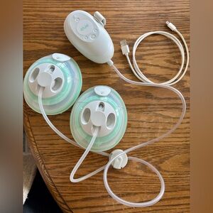 Elvie Stride Breast Pump with accessories